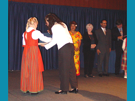 ICAF Board Member Katty Guerami presents award to young artist