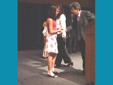 ICAF Director Dr. Ashfaq Ishaq presents award to young artist