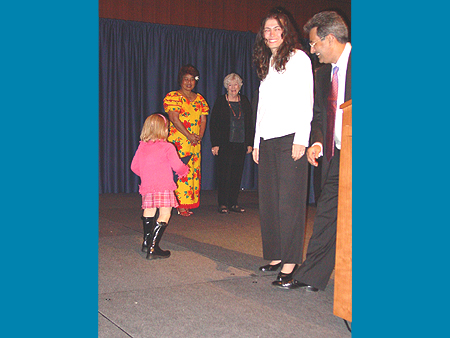 ICAF Director Dr. Ashfaq Ishaq presents award to young artist