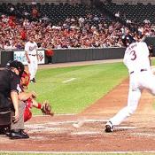 #3 Larry Bigbie connects with the ball to get the Birds on base.