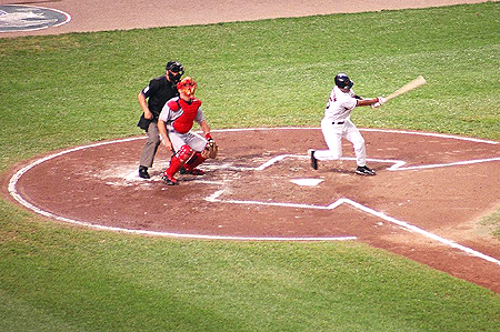 The bases are loaded and the Orioles get a hit to bring home a run.