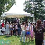 A crowd gathers to watch this local band play their set.