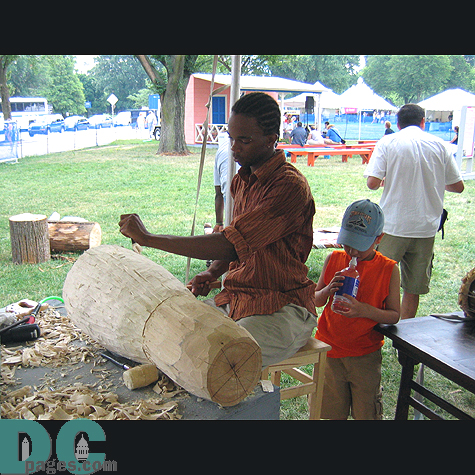 Making another drum by chipping away at this piece of wood.