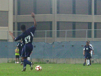 Kwesi Graham, a senior midfielder from Howard University, dribbles the ball down the field.