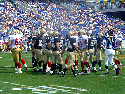The Midshipmen get ready for a huddle before the next play.