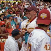 Observe the energy and technicue of this Redskin fan tearing up a dolphin banner in Fedex.