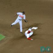 Even though they were down four runs, the Washington Nationals players still gave it their all. Here a sliding player preventing a double play ball.