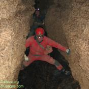 Cavers avoiding a cold rushing stream - keeping dry is essential to keeping warm