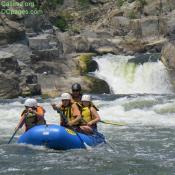 The "Spout" of Great Falls visible as Rafters make their way down the Mather Gorge.
