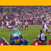 Redskins Quarterback, Todd Collins, throws a pigskin towards #47