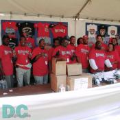 Washington Nationals' Inaugural Home Opener - Staff from the official Washington Nationals fan store offer their smiles and supports for both the city and team.