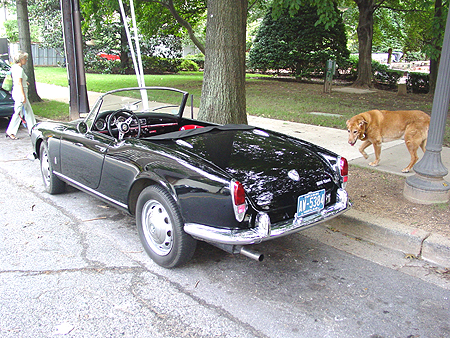He always is compelled to check out vintage sports cars.