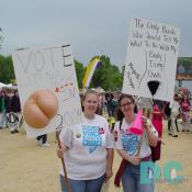 Two Pro-Choice activists from Marqutte, Michigan proudly wear their MICHIGAN VOICE FOR CHOICE t-shirts and hold their placards that read - VOTE, LETS KICK, BUSHS (3-D buttock sculpture), IN, 2004 and THE ONLY BUSH, WHO SHOULD TELL ME, WHAT TO DO WITH MY, BODY, IS MY, OWN (outline of naked female), MARQUETTE, MICHIGAN.