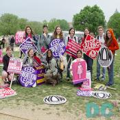 Eleven activists hold demonstration signs from top left to right - SEX ED SAVES LIVES - YOUNG FEMINISTS MOBILIZING - KEEP ABORTION LEGAL - DERECHOS REPRODUCTIVOS SON DERECHOS HUMANOS - STOP VIOLENCE AGAINST WOMEN - NOW, NATIONAL ORGANIZATION WOMEN - Bottom left to right - STUDENTS FOR CHOICE - KEEP ABORTION LEGAL - WOMEN OF COLOR - MY BODY IS PUBLIC -