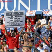 John McCain supporter holds up large rally sign