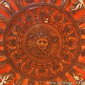 A closeup of the chandelier shows Medusa surrounded by twelve greek figures.