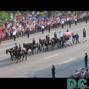 Everyone watches and pays their respect to Reagan passing by.