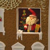 Santa Claus pays a visit to the gingerbread White House.