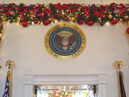The official seal of the President stands before all in the State Dining Room.