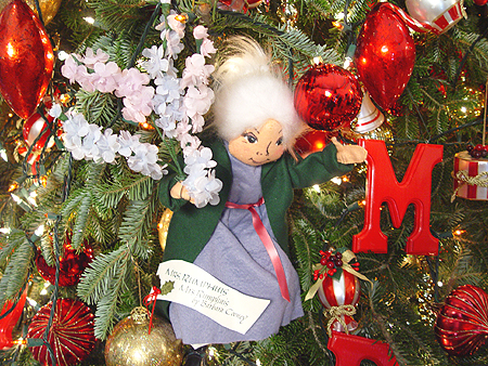 The old woman from Tikki Tikki Tembo hangs from the Christmas tree.