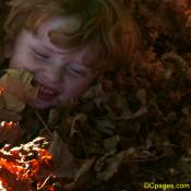 Luke Jr. buried in leaves.