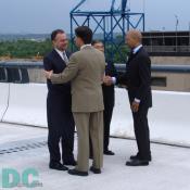 Virginia Governor Timothy M. Kaine and Maryland Governor Robert L. Ehrlich shake hands, while District Mayor Anthony A. Williams greets U.S. Secretary of Transportation Norman Y. Mineta.