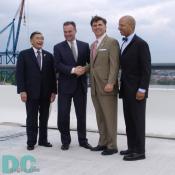 U.S. Secretary of Transportation Norman Y.
Mineta and District Mayor Anothy A Williams surround Virginia Governor Timothy M. Kaine and Maryland Governor Robert L. Ehrlich Jr. shaking hands.