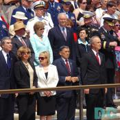 Government leaders watch the ceremony.