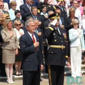 President George W. Bush stands with U.S. Army Major General Guy Swan for a moment of silence.
