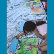 Young Artist works on her Art for Peace Pyramid panel